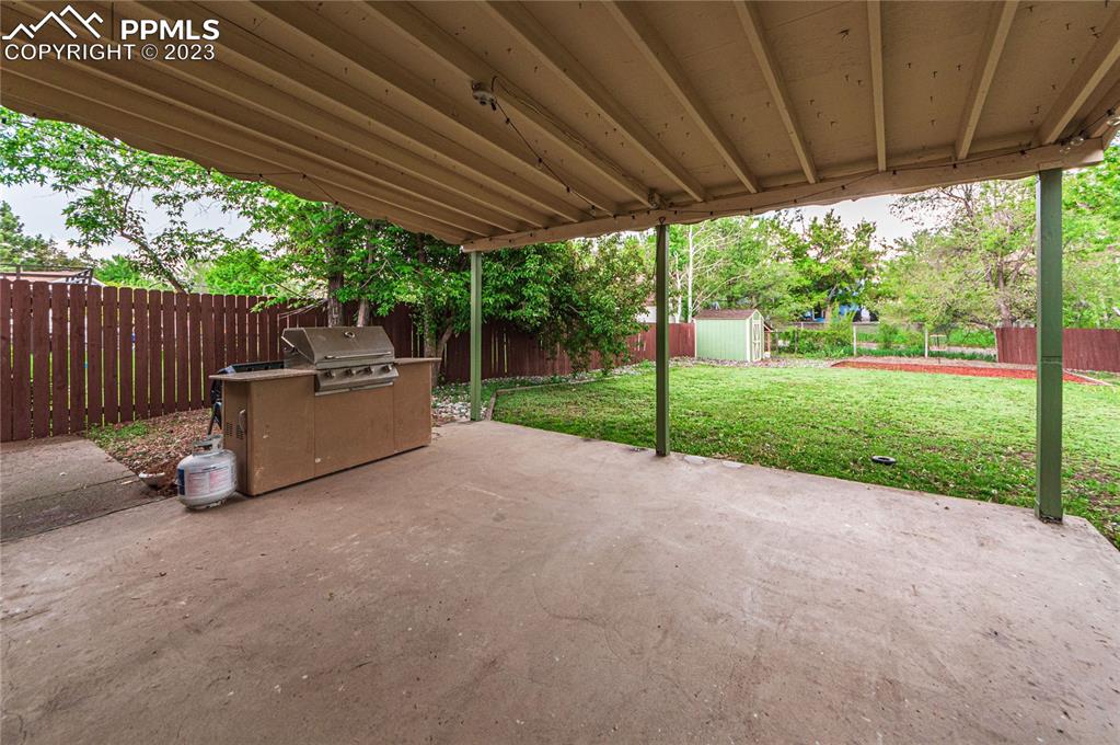 1917 Wooten Road Colorado Springs, CO 80915 - Photo 28 of 35 a view of a couches in the patio next to a yard
