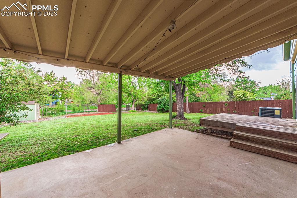 1917 Wooten Road Colorado Springs, CO 80915 - Photo 30 of 35 a view of a house with backyard and a backyard