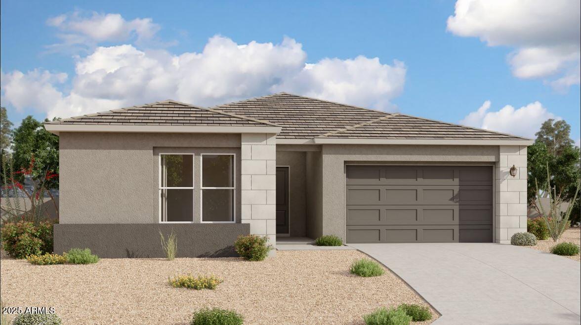 a front view of a house with a yard and garage