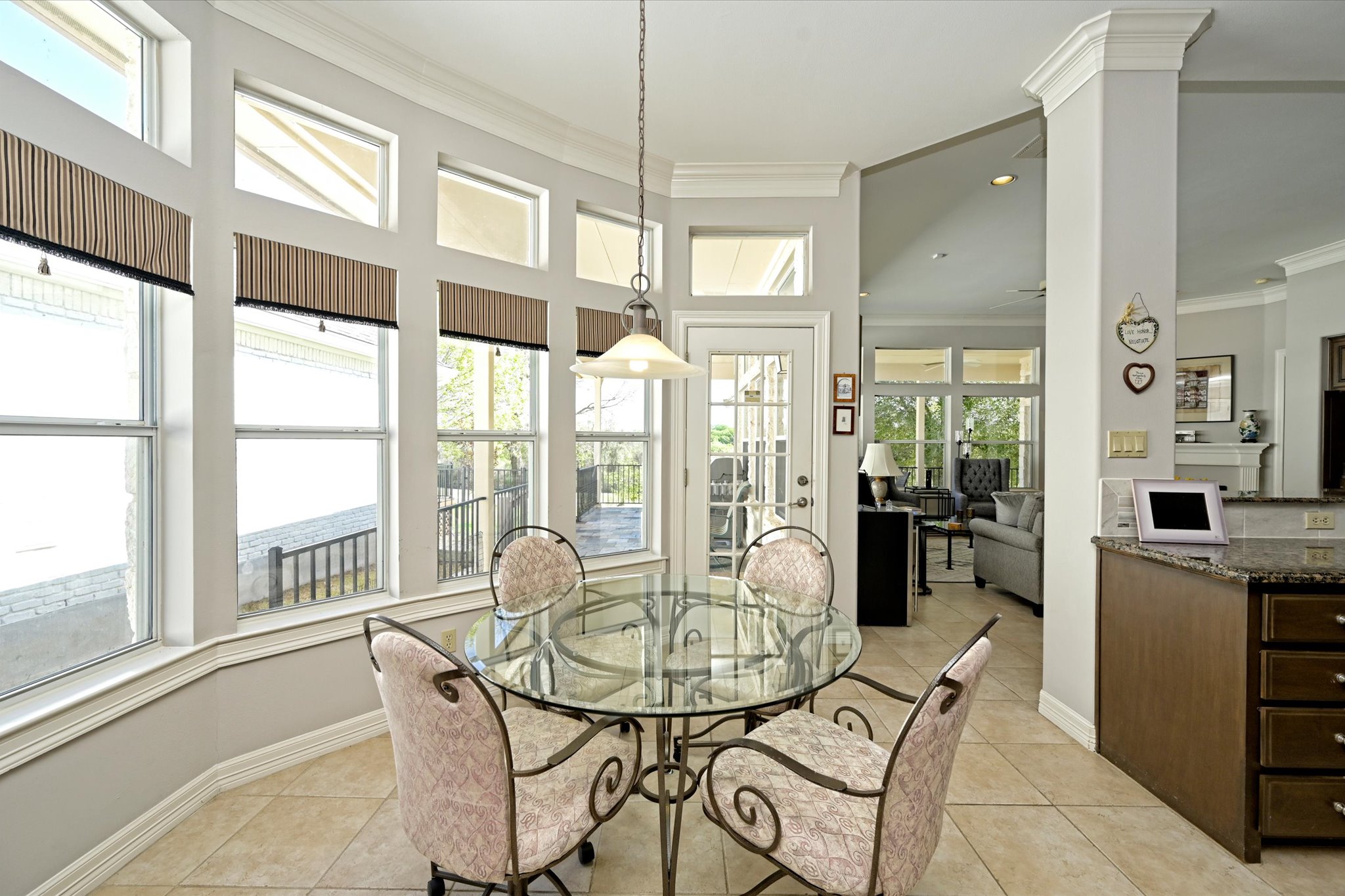 4912 Interlachen Lane Austin, TX 78747 - Photo 11 of 39 a view of a dining room with furniture window and outside view