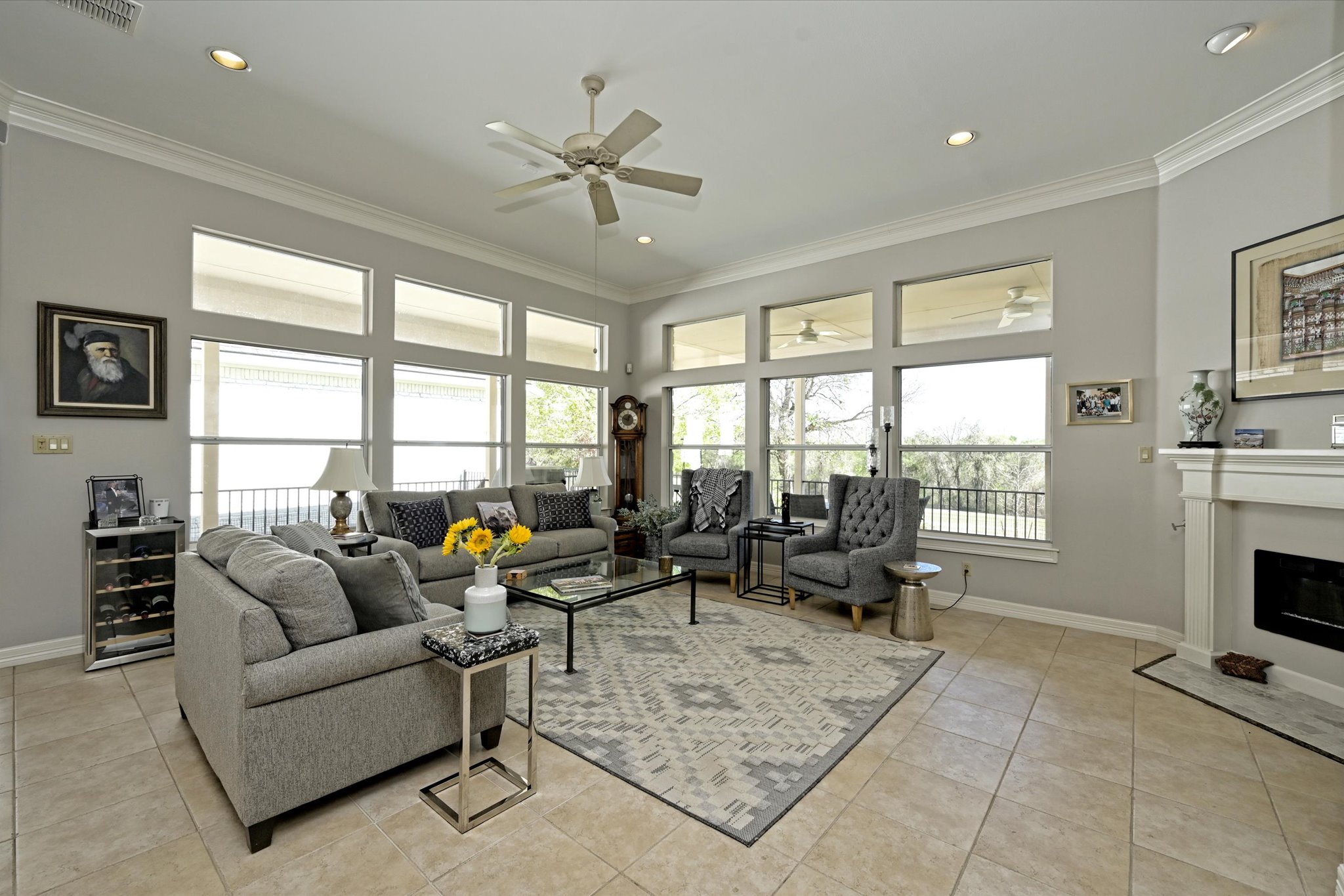 4912 Interlachen Lane Austin, TX 78747 - Photo 13 of 39 a living room with furniture and floor to ceiling windows