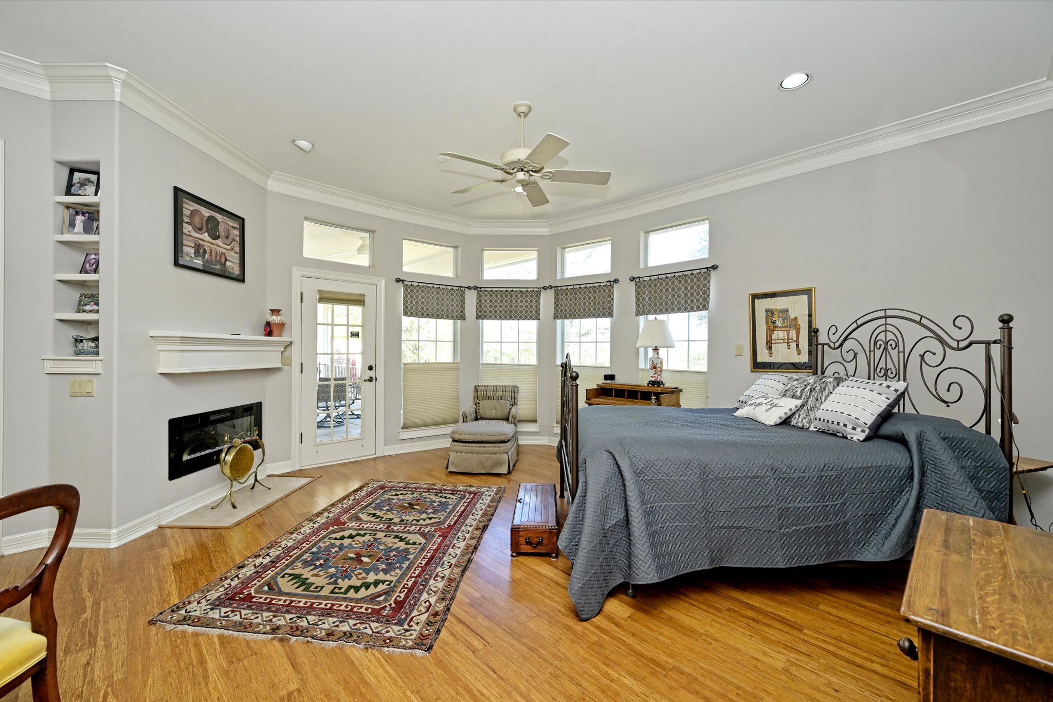 4912 Interlachen Lane Austin, TX 78747 - Photo 16 of 39 a living room with a bed furniture and a fireplace
