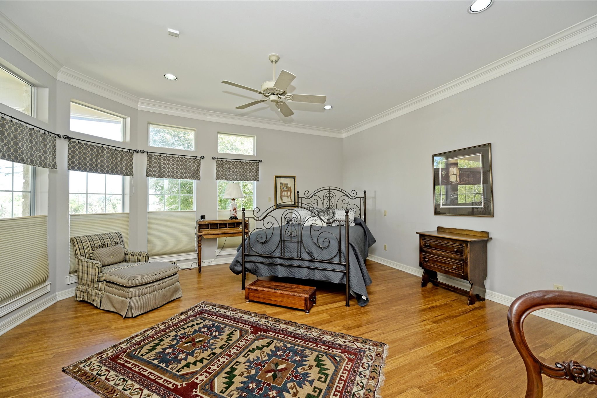 4912 Interlachen Lane Austin, TX 78747 - Photo 17 of 39 a bedroom with furniture and wooden floor