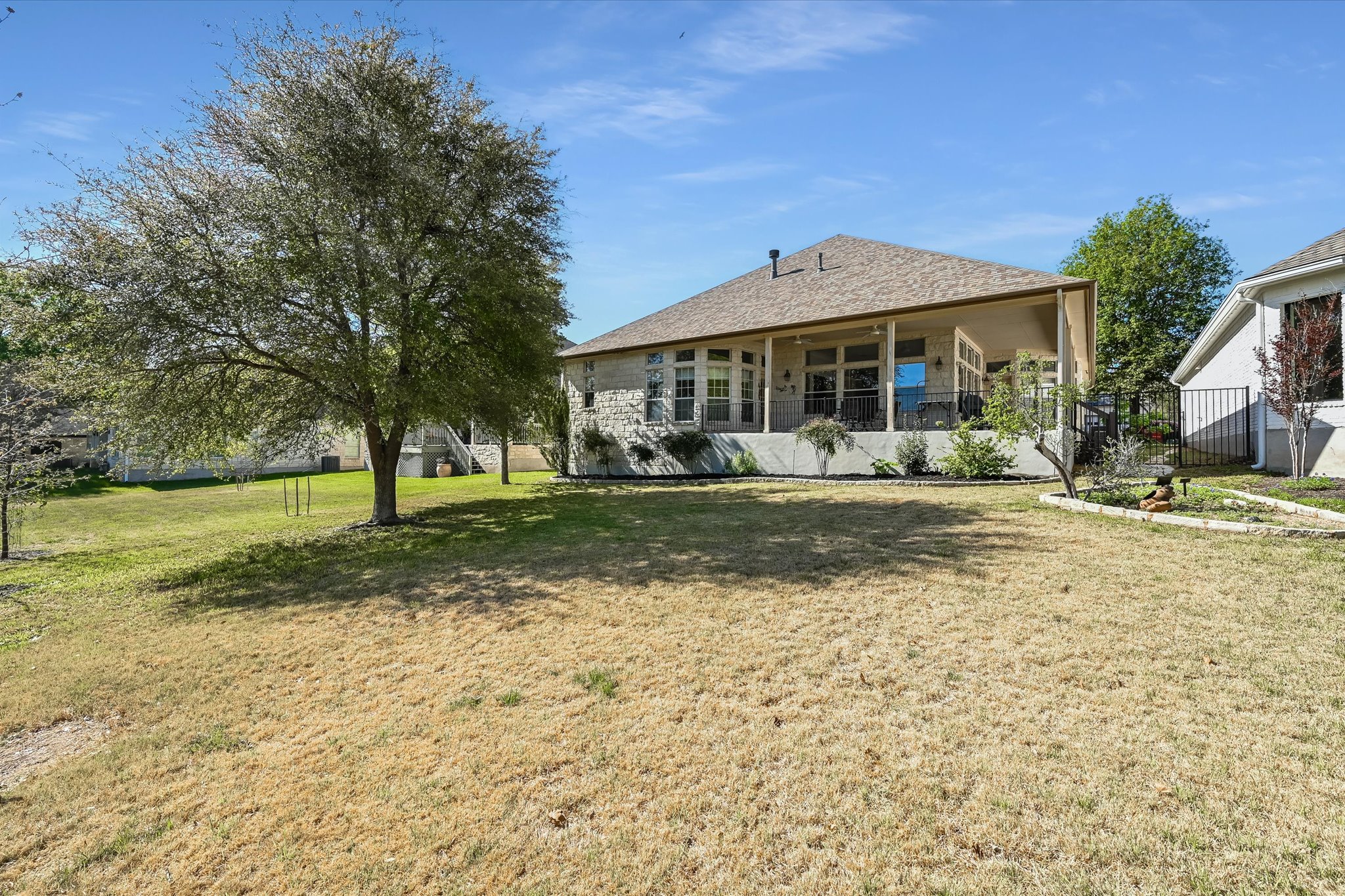 4912 Interlachen Lane Austin, TX 78747 - Photo 27 of 39 a front view of a house with a yard