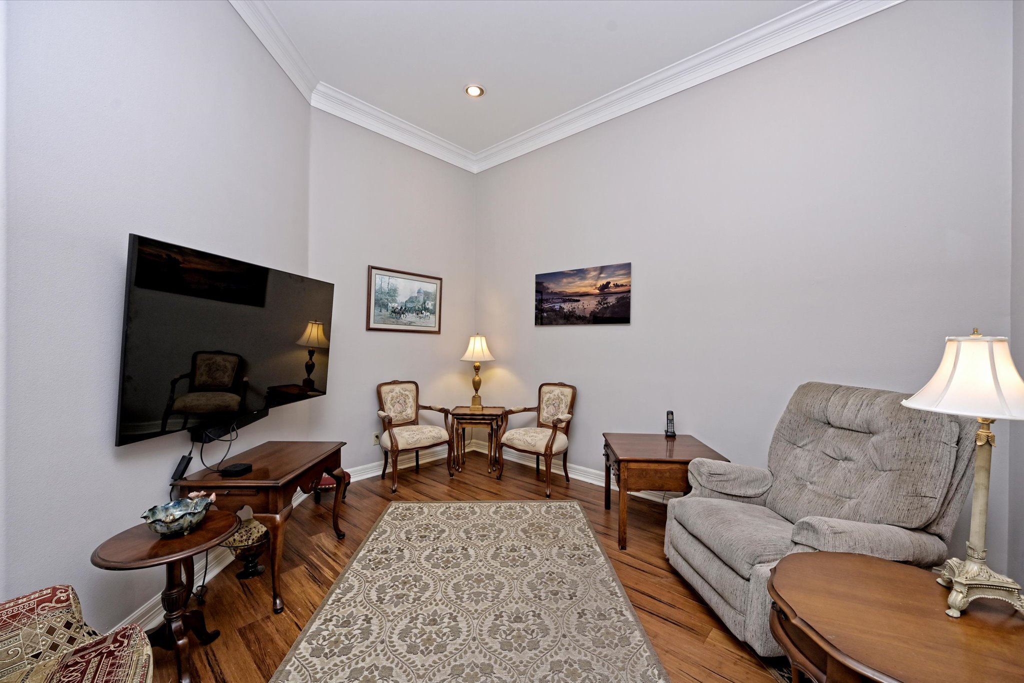 4912 Interlachen Lane Austin, TX 78747 - Photo 3 of 39 a living room with furniture and a flat screen tv