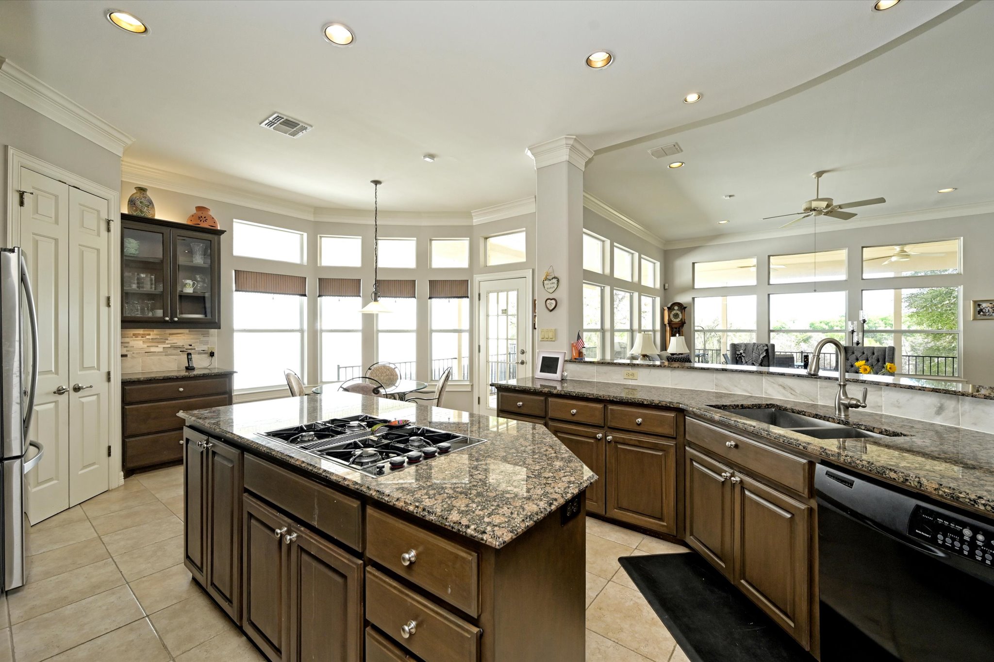 4912 Interlachen Lane Austin, TX 78747 - Photo 9 of 39 a kitchen with a sink stove and refrigerator