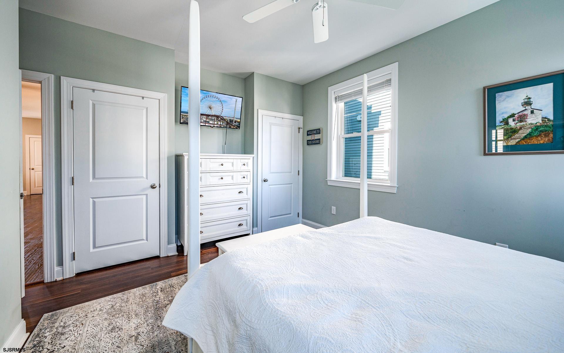 225 West Inlet Road Ocean City, NJ 08226 - Photo 12 of 56 a bedroom with a bed and a window