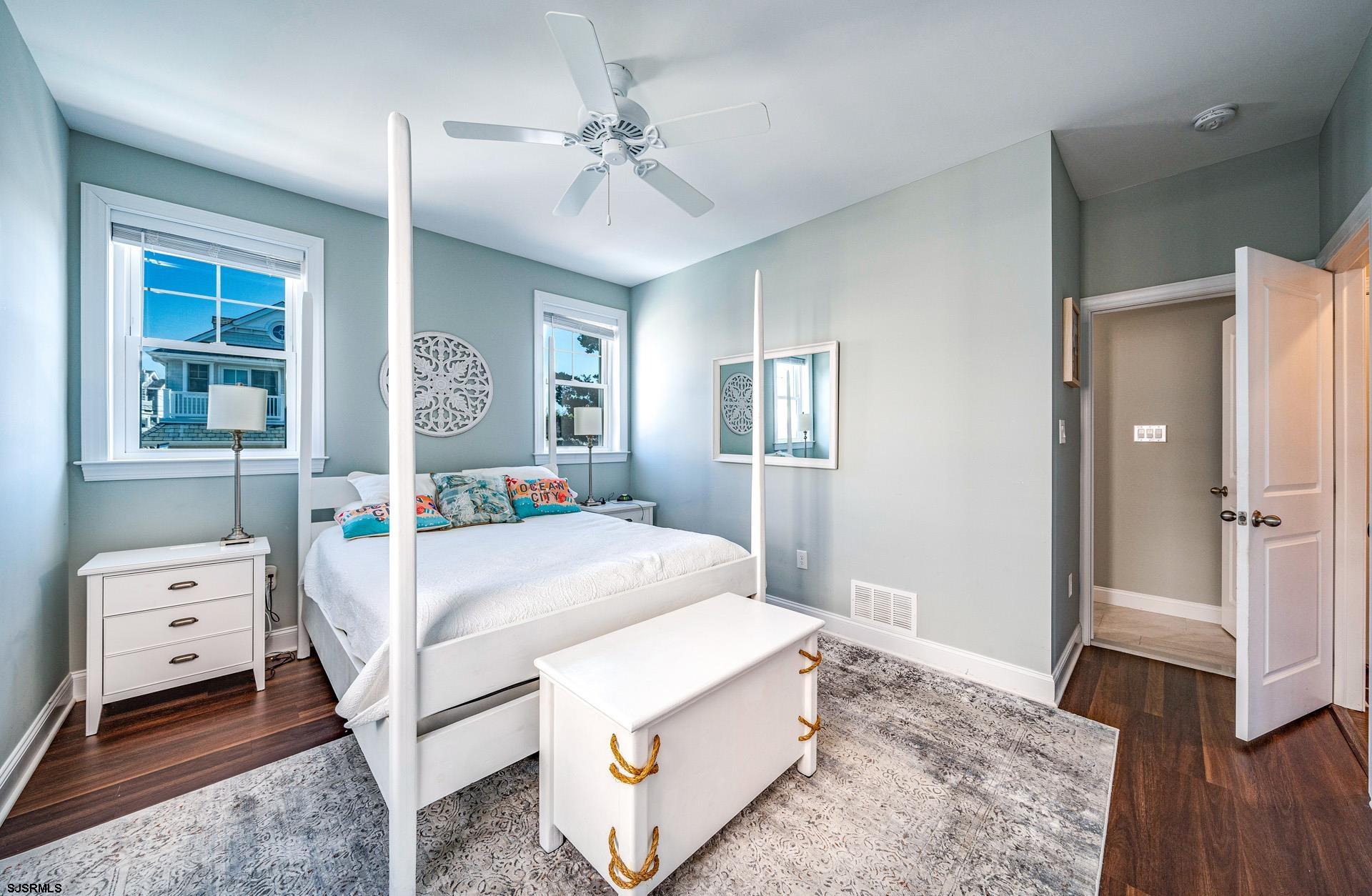 225 West Inlet Road Ocean City, NJ 08226 - Photo 13 of 56 a bedroom with a bed and wooden floor