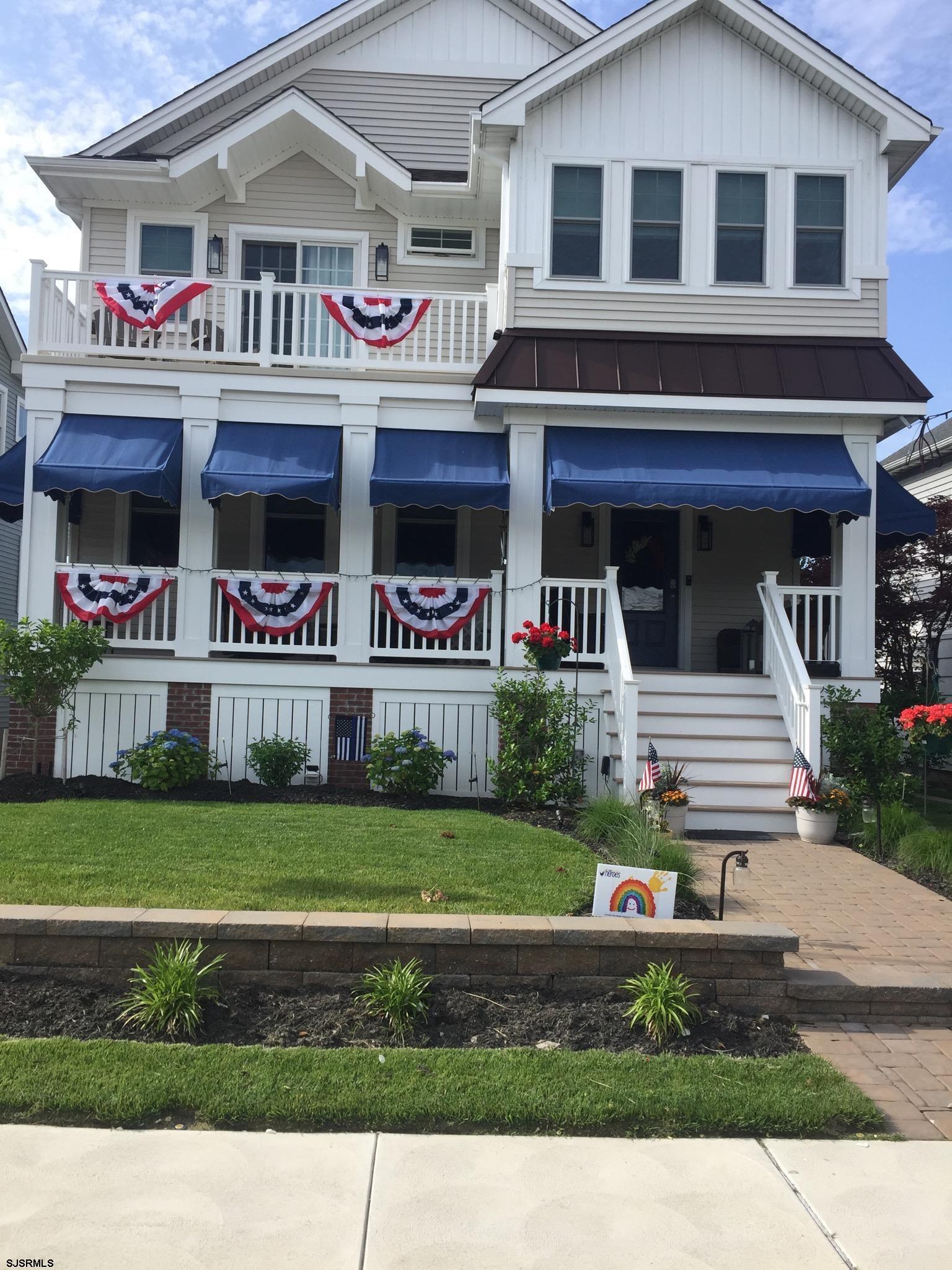 225 West Inlet Road Ocean City, NJ 08226 - Photo 2 of 56 a front view of a house with a yard