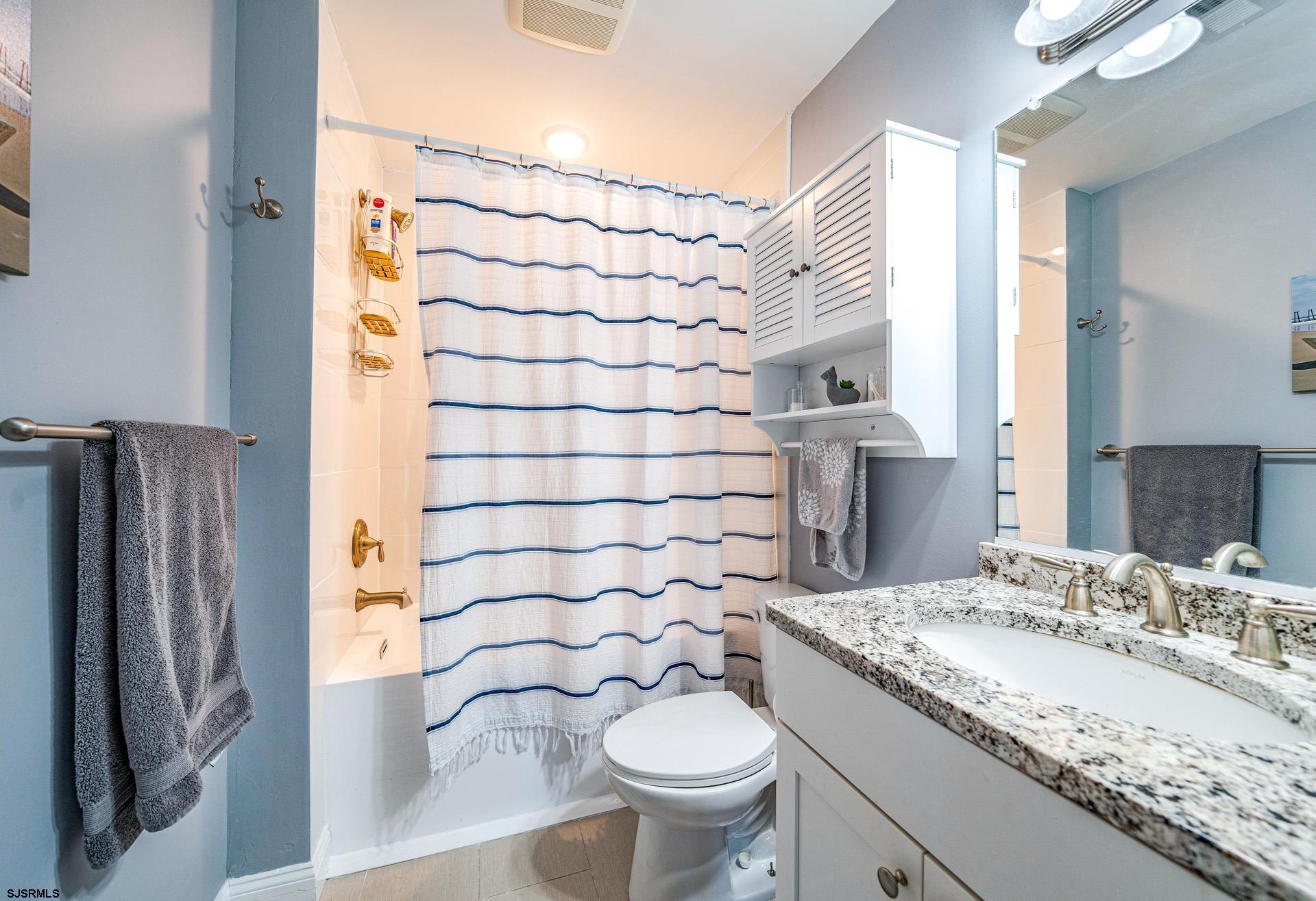 225 West Inlet Road Ocean City, NJ 08226 - Photo 23 of 56 a bathroom with a granite countertop toilet sink and shower