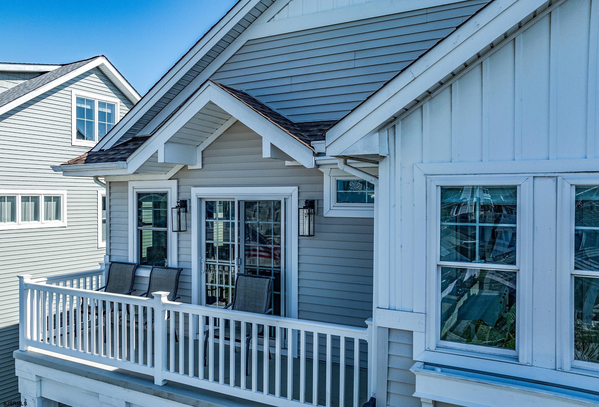 225 West Inlet Road Ocean City, NJ 08226 - Photo 29 of 56 a porch with a table and chairs