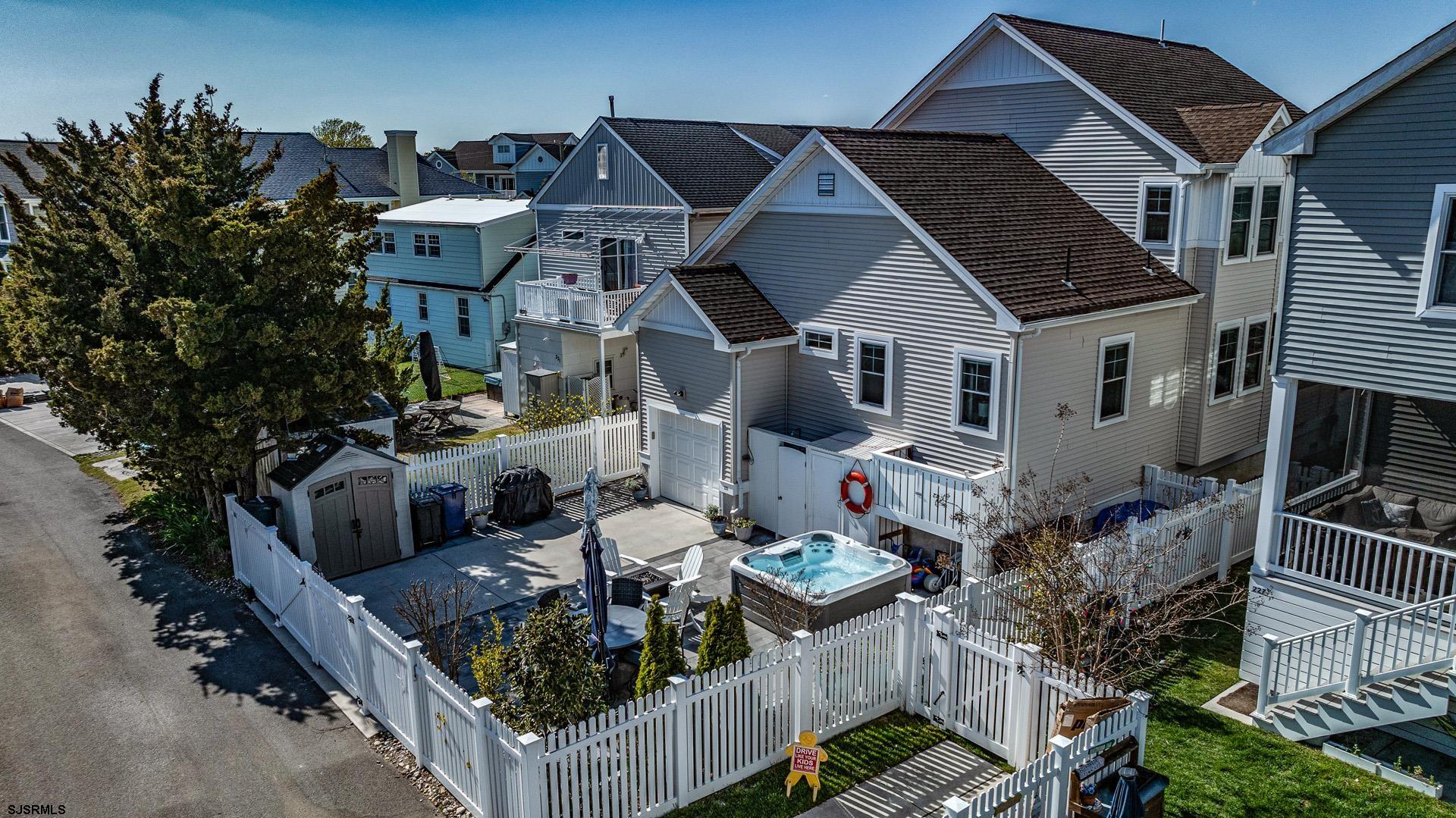 225 West Inlet Road Ocean City, NJ 08226 - Photo 40 of 56 a view of a house with backyard and sitting area