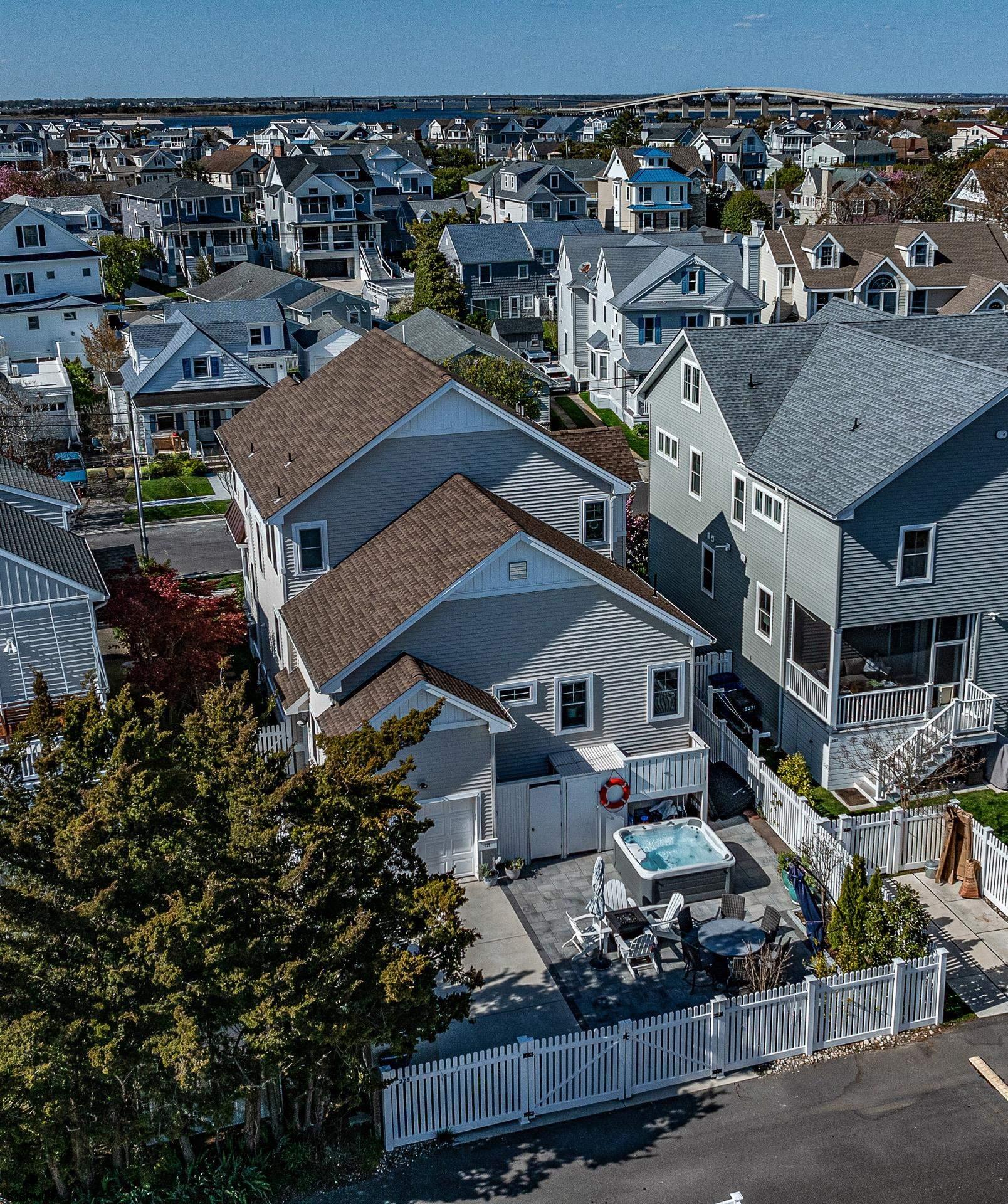 225 West Inlet Road Ocean City, NJ 08226 - Photo 42 of 56 an aerial view of a house with a yard