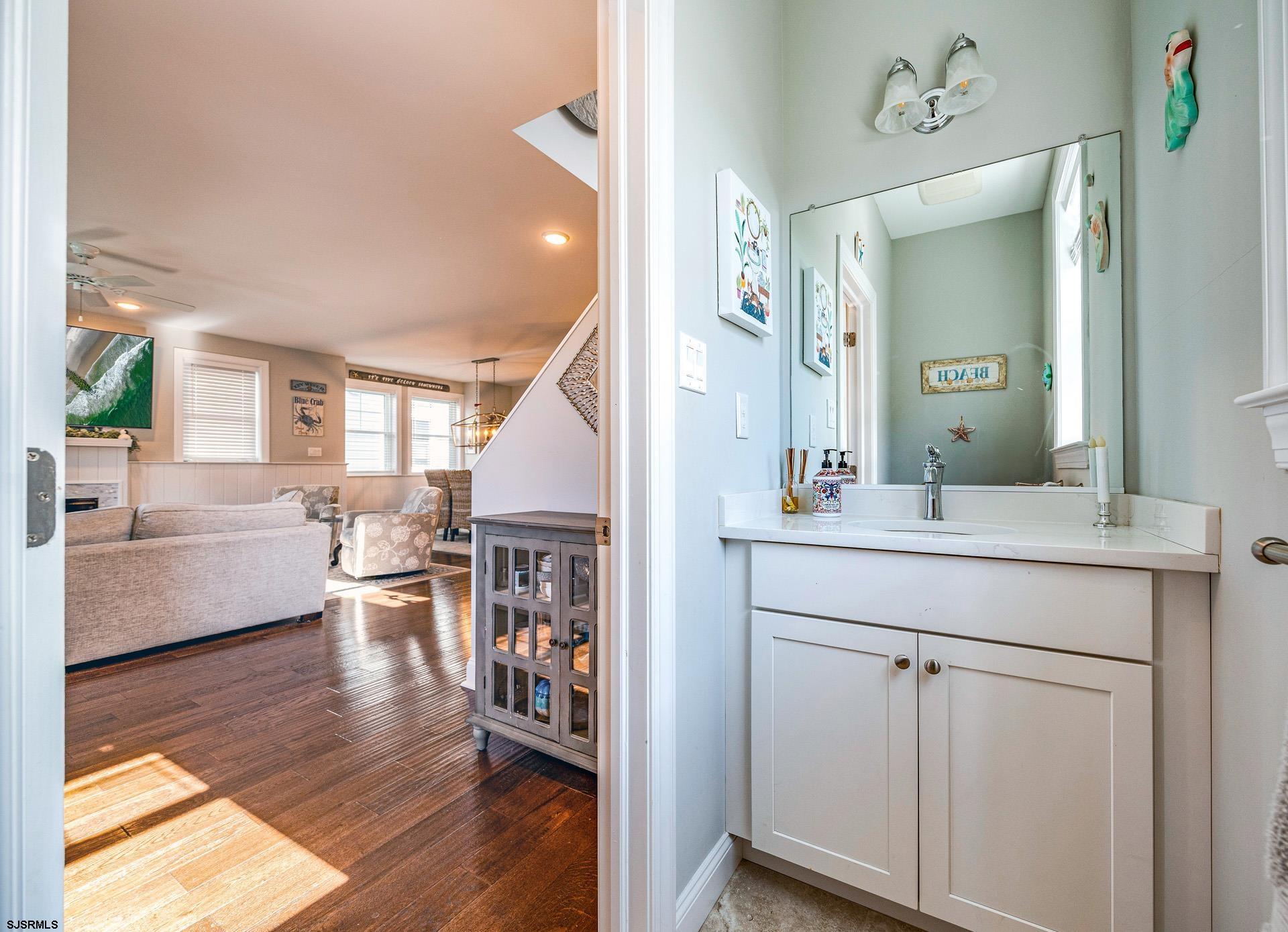 225 West Inlet Road Ocean City, NJ 08226 - Photo 5 of 56 a spacious bathroom with a granite countertop sink a mirror and vanity