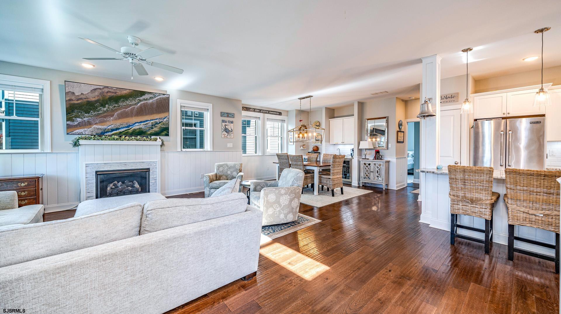 225 West Inlet Road Ocean City, NJ 08226 - Photo 8 of 56 a living room with fireplace furniture and a large window