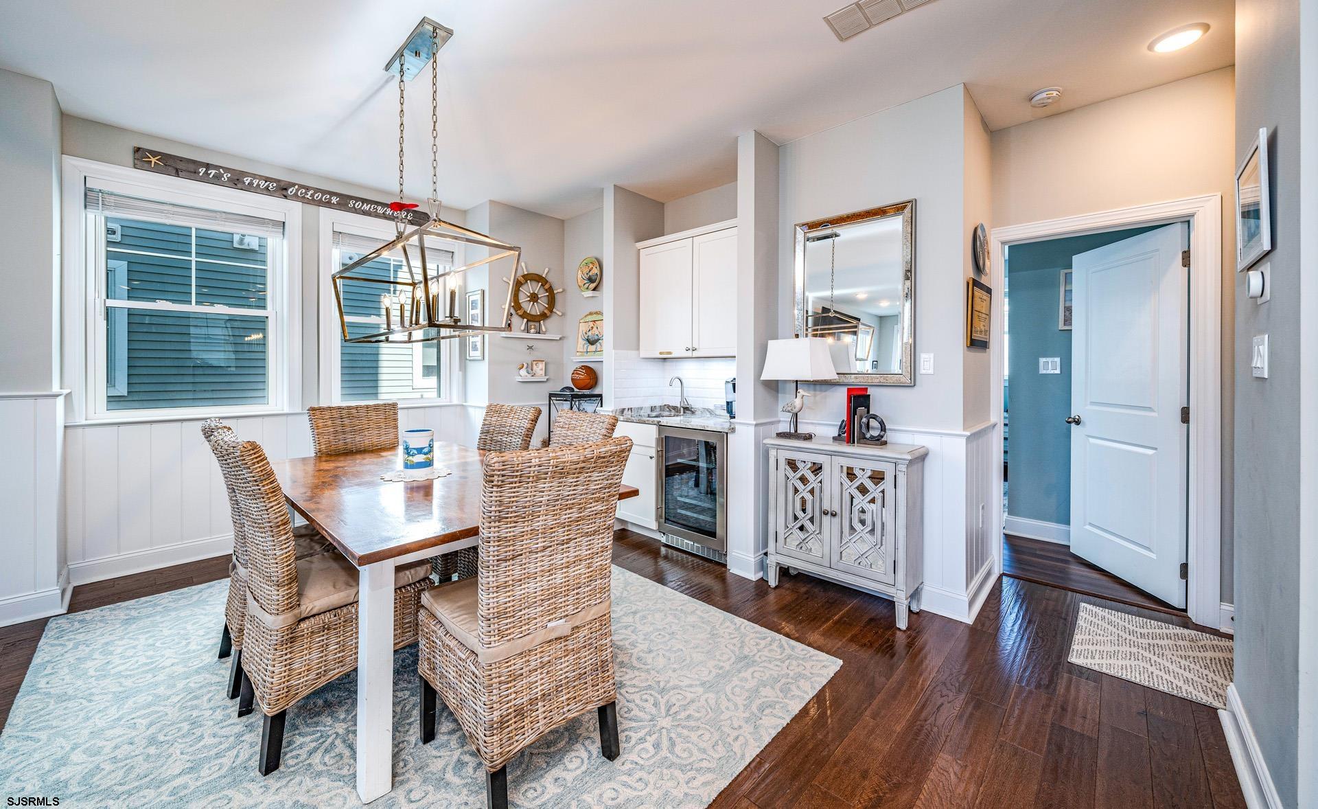 225 West Inlet Road Ocean City, NJ 08226 - Photo 9 of 56 a dining room with furniture window wooden floor