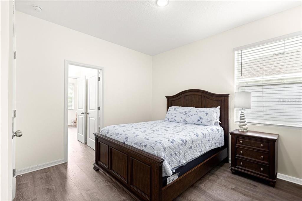 5851 Southwest 85th Place Ocala, FL 34476 - Photo 28 of 57 a bedroom with a bed and dresser