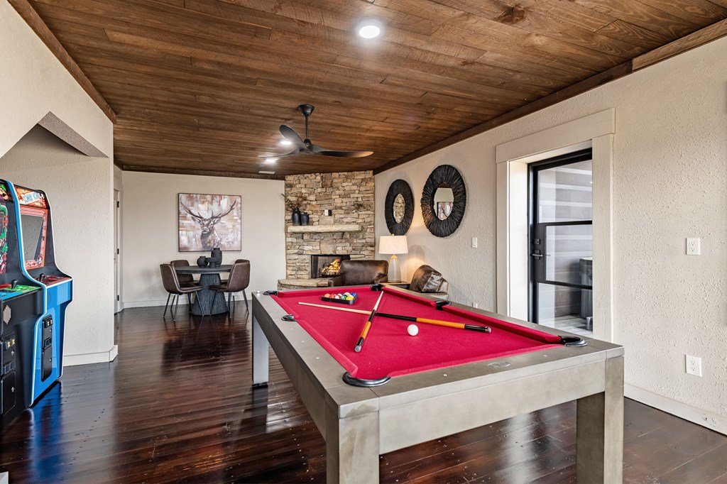 799 Bruce Mountain Road Morganton, GA 30560 - Photo 42 of 48 a room with gym equipment pool table and wooden floor
