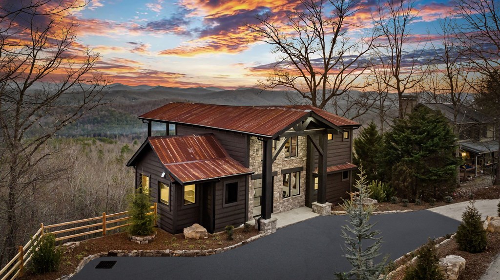 799 Bruce Mountain Road Morganton, GA 30560 - Photo 47 of 48 a view of a house with a small yard and a wooden deck