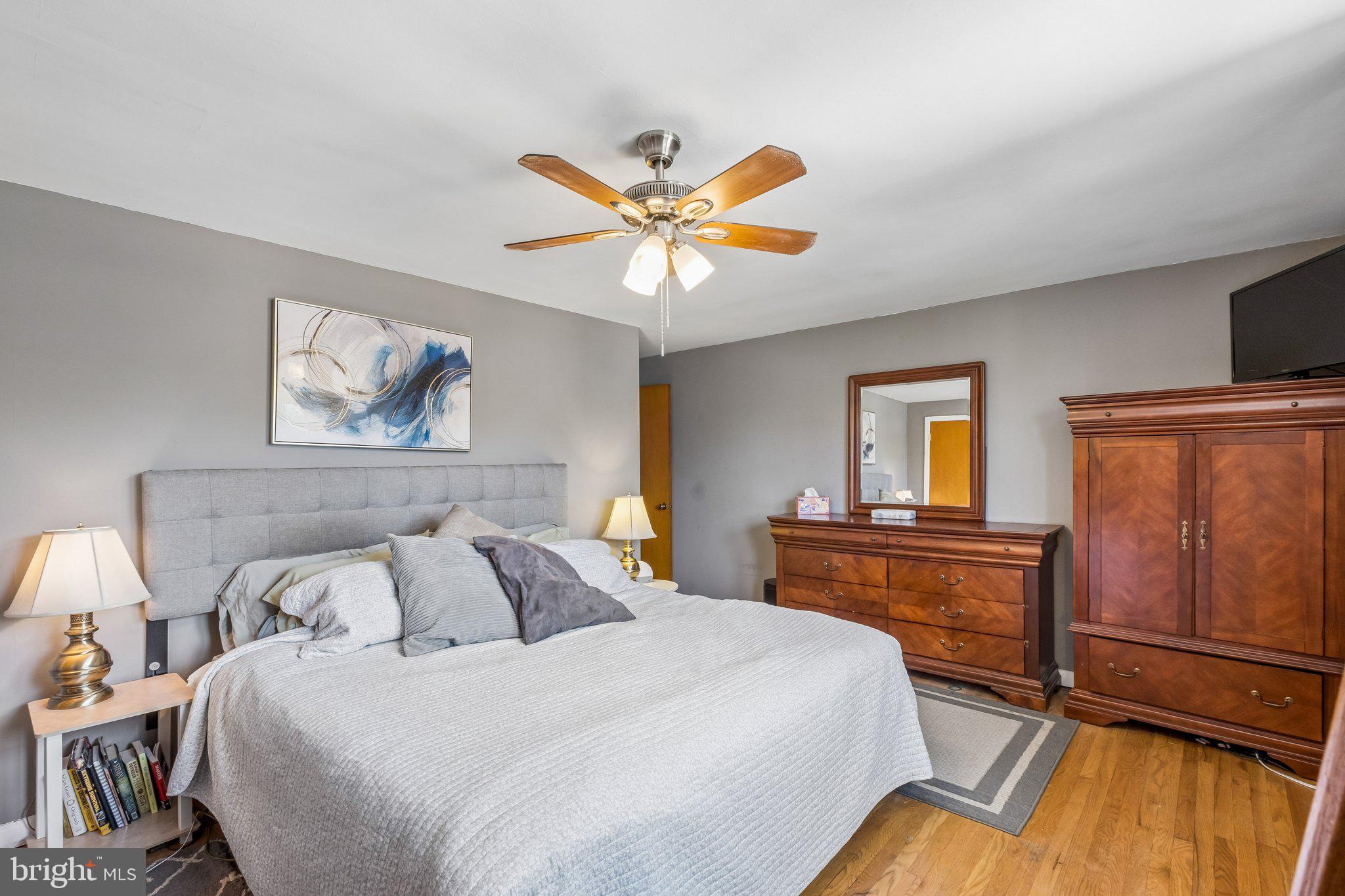 725 Hill Road Philadelphia, PA 19128 - Photo 18 of 43 a bedroom with a bed and wooden floor