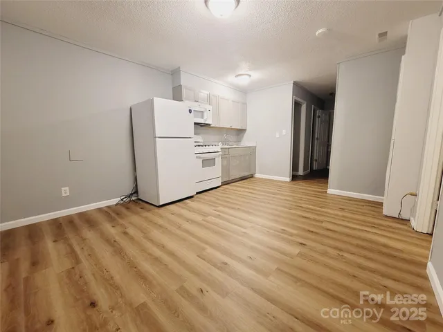 a view of kitchen and wooden floor
