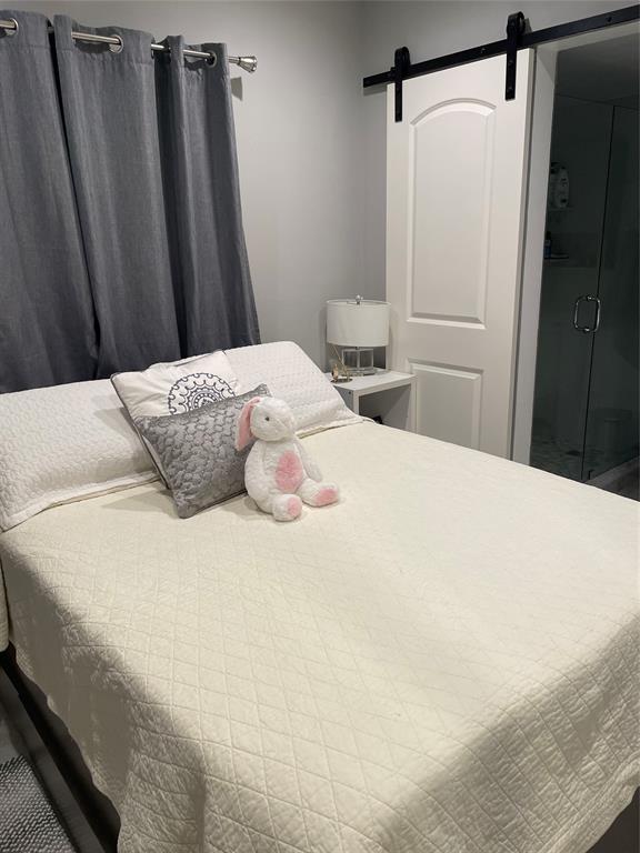 5601 Northwest 2nd Avenue, Unit 3190 Boca Raton, FL 33487 - Photo 8 of 16 a bedroom with a bed and a shower