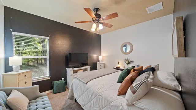 a view of a livingroom with workspace and a couch