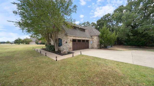 an aerial view of residential houses with outdoor space and swimming pool