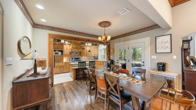 a kitchen with granite countertop cabinets stainless steel appliances and a sink