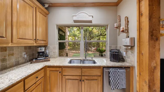 a kitchen with a table and chairs