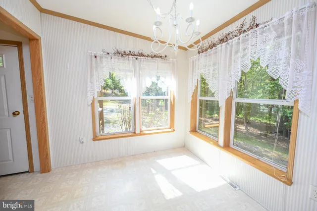 a kitchen with stainless steel appliances a stove a sink and a refrigerator
