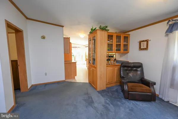 a bedroom with bed and a dresser