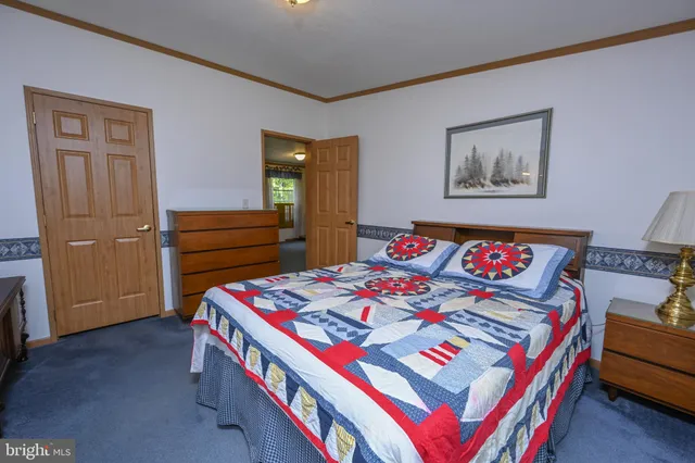 a bathroom with a sink a mirror and a window