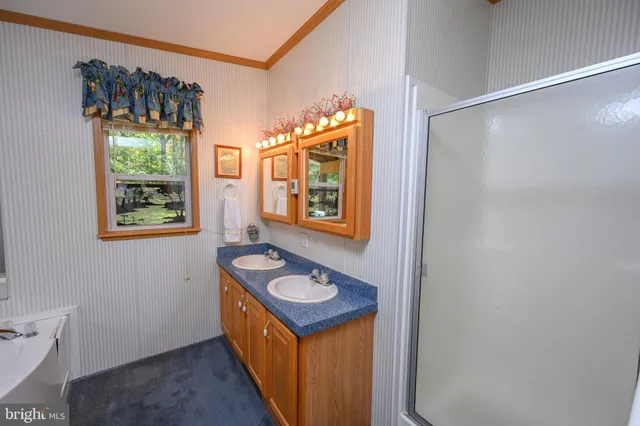 a en suite bathroom with a toilet sink and tub