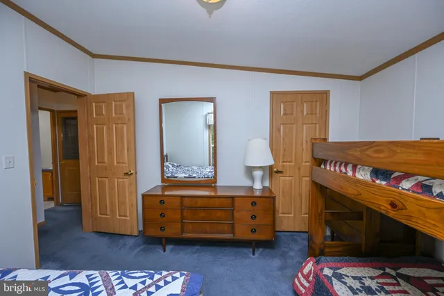 a bedroom with a bed and a view of bathroom