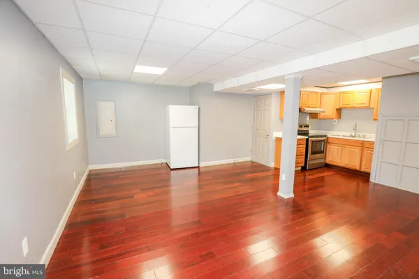 a kitchen with a stove and a refrigerator