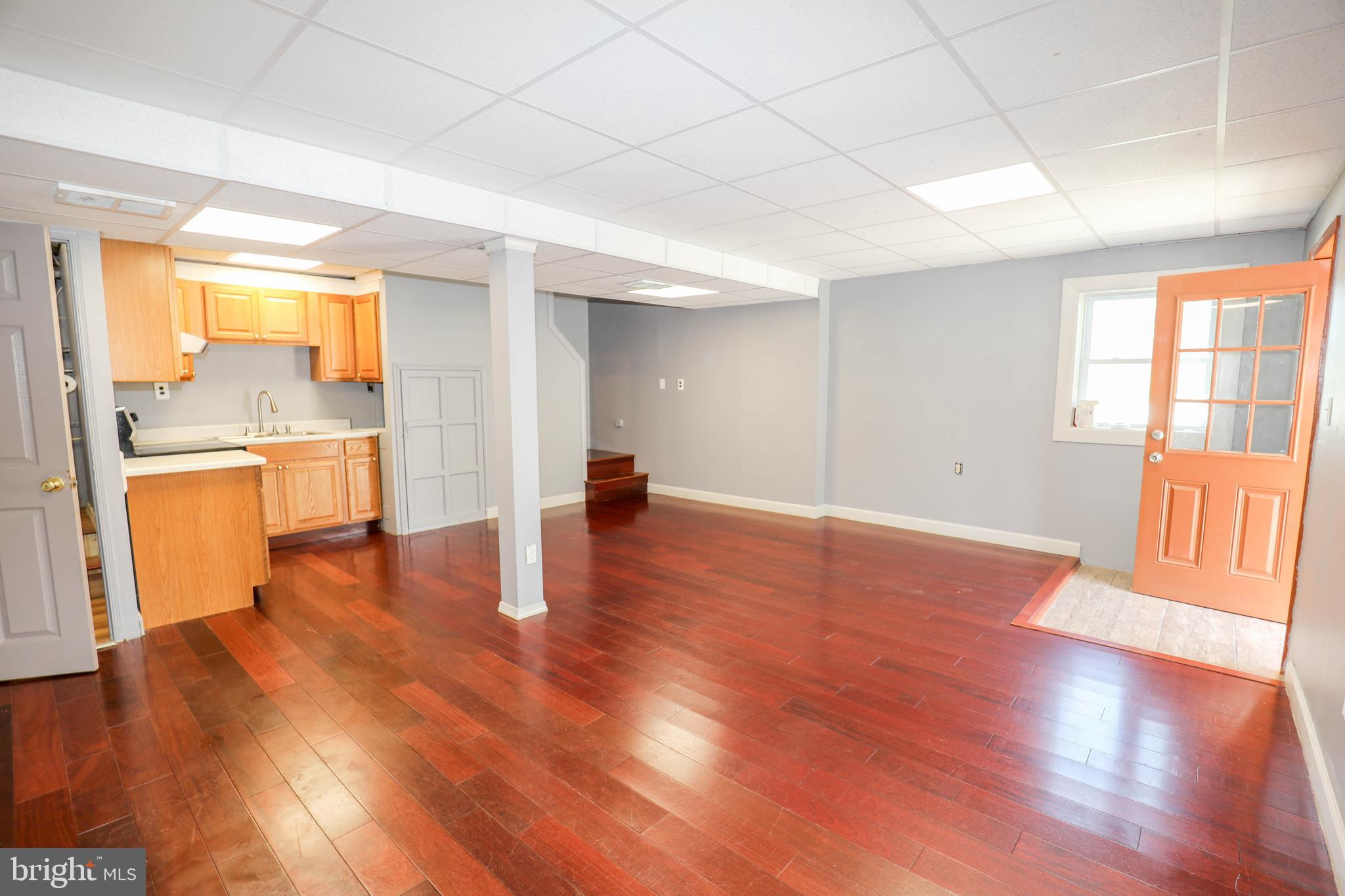 103 R Waelchli Avenue Halethorpe, MD 21227 - Photo 17 of 37 a view of a room with wooden floor and a window