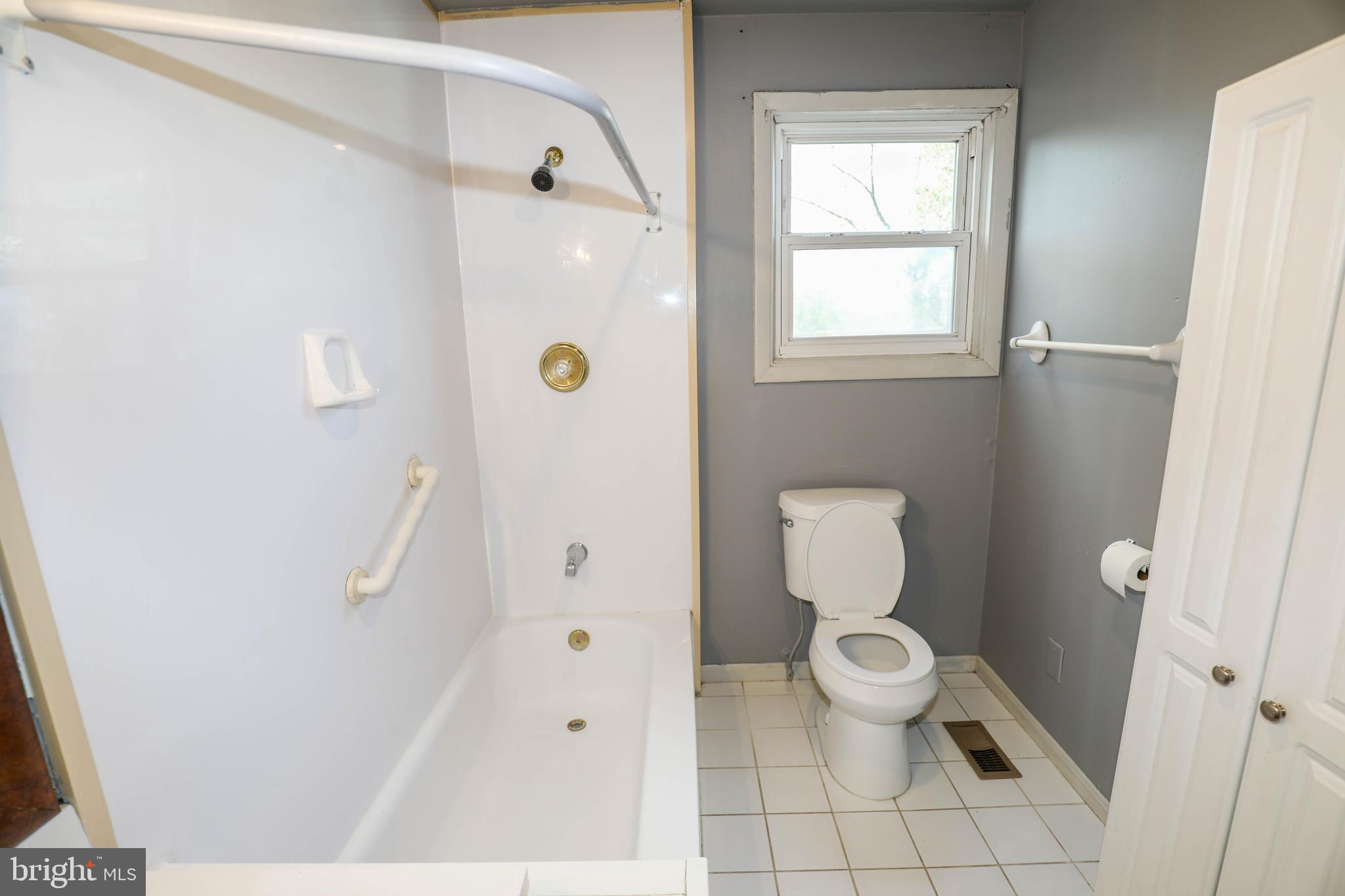 103 R Waelchli Avenue Halethorpe, MD 21227 - Photo 27 of 37 a bathroom with a toilet and a shower