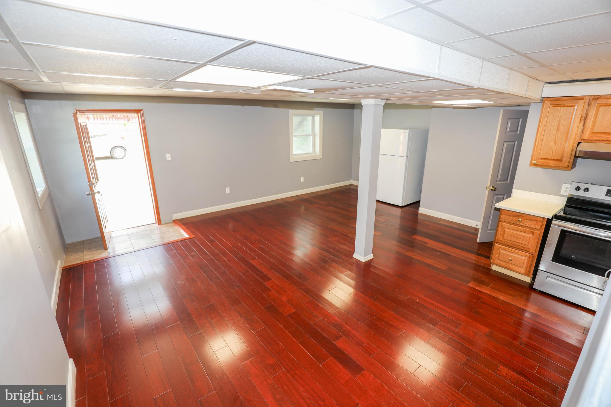 103 R Waelchli Avenue Halethorpe, MD 21227 - Photo 33 of 37 a view of empty room with wooden floor and fan