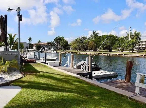 a view of a lake with a house in the background