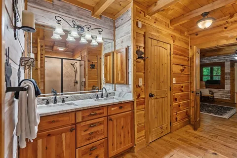 a bathroom with a glass shower door