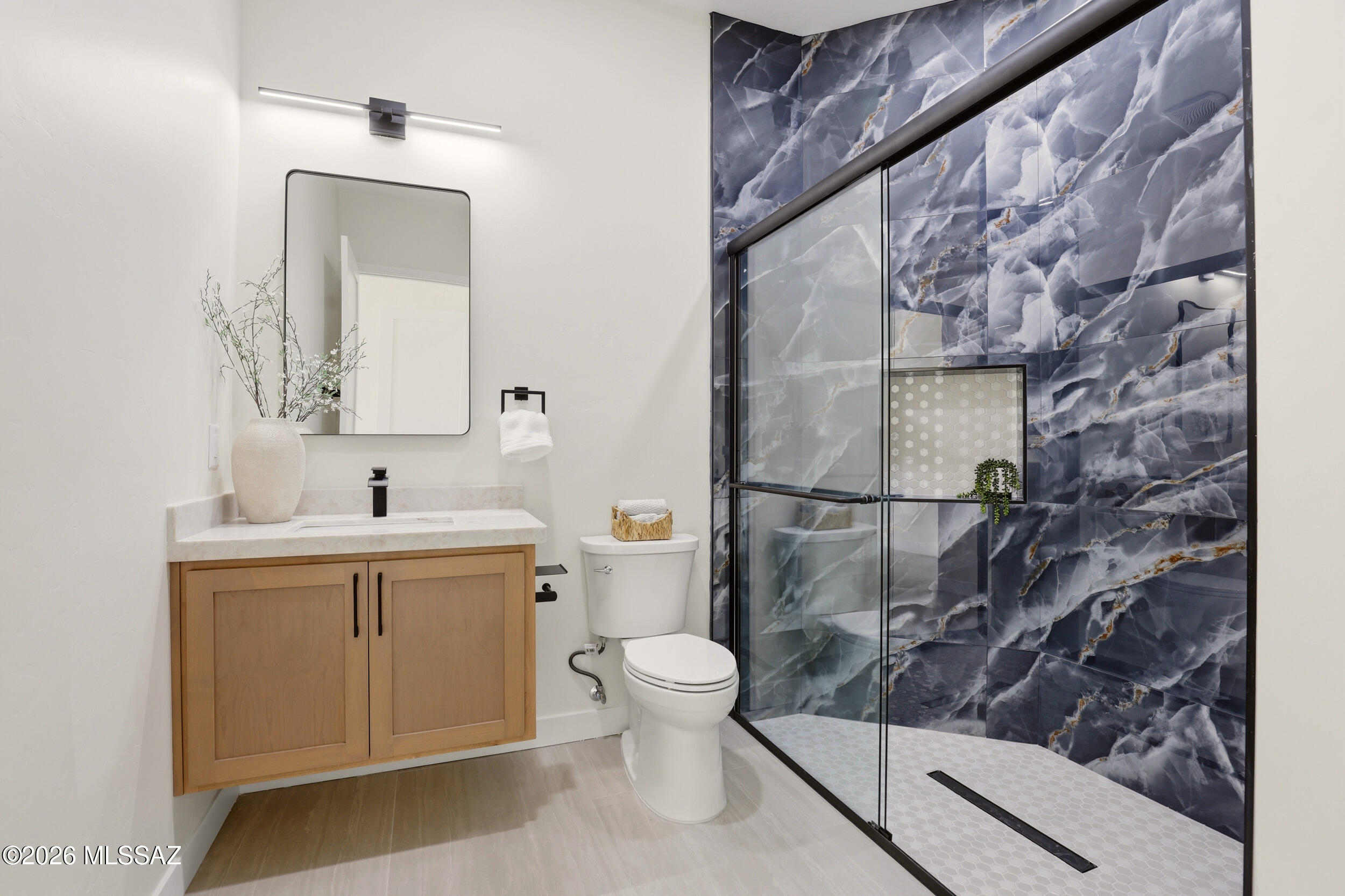 14527 East Sands Ranch Road Vail, AZ 85641 - Photo 33 of 48 a bathroom with a sink a toilet and shower