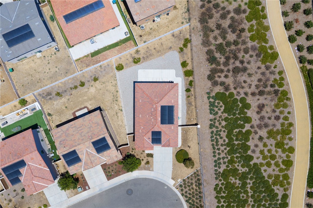 20130 Curaco Court Riverside, CA 92507 - Photo 5 of 43 Overhead aerial view of the home, lot, roof, and surrounding area.