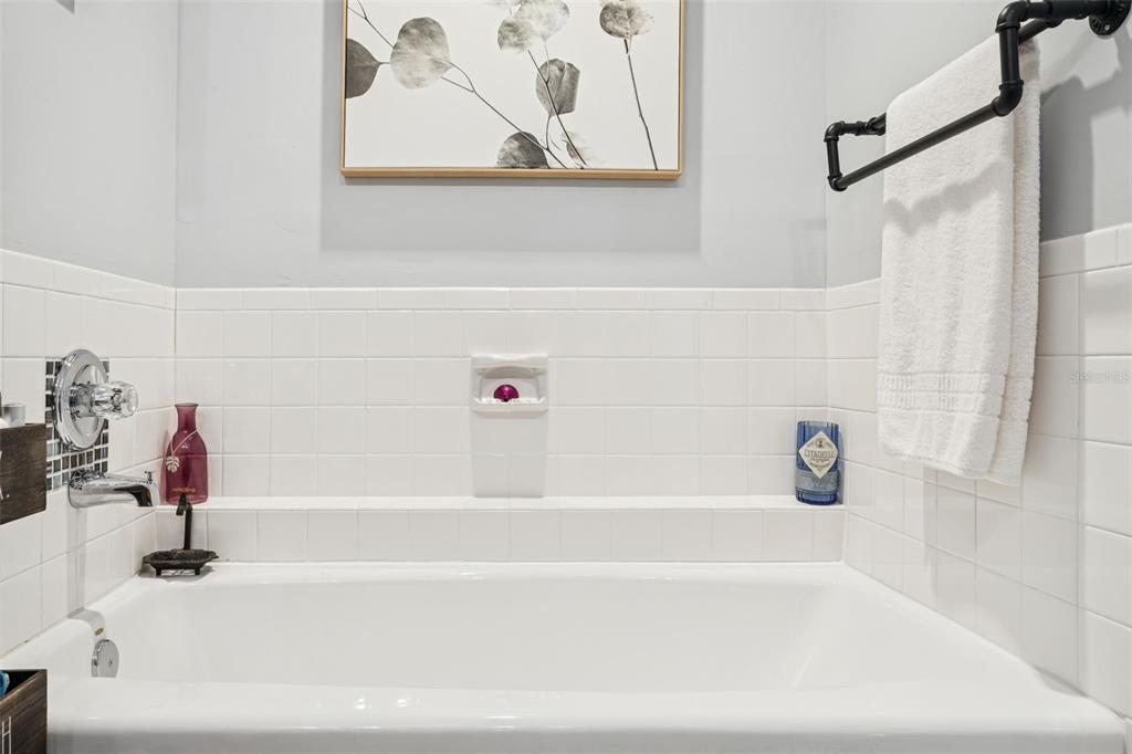 2603 North Ridgewood Avenue Tampa, FL 33602 - Photo 23 of 44 a bathroom with a bathtub and a shower