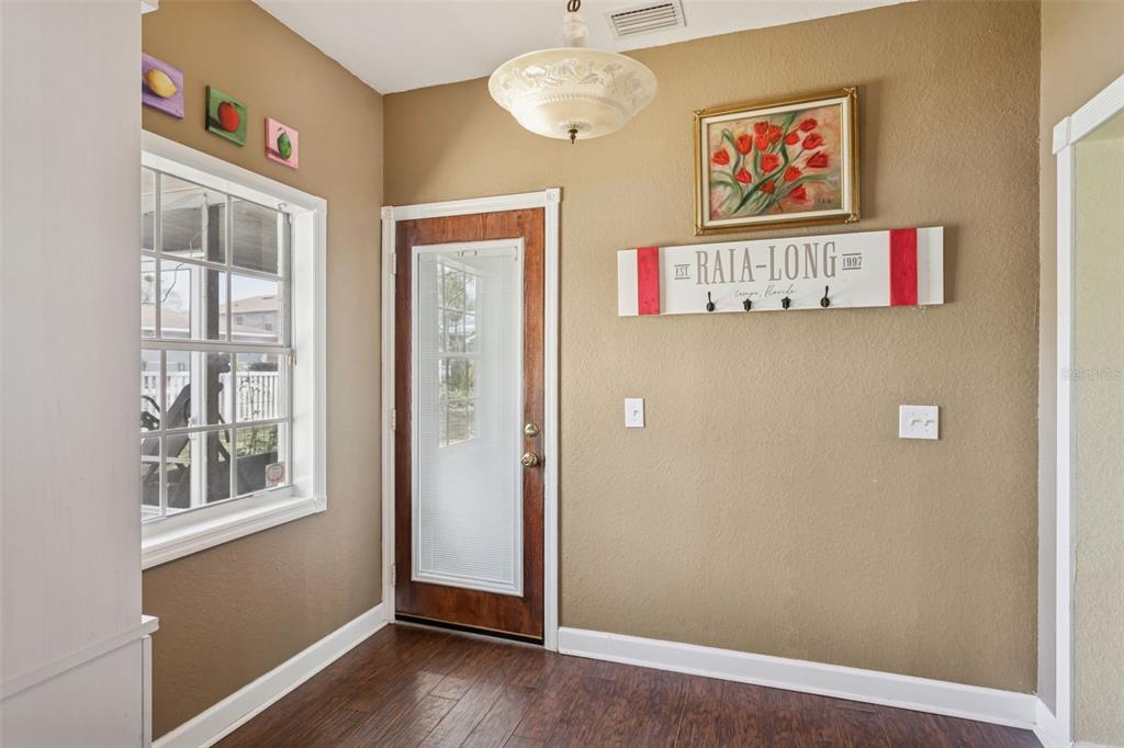 2603 North Ridgewood Avenue Tampa, FL 33602 - Photo 29 of 44 a view of an empty room with a window and wooden floor