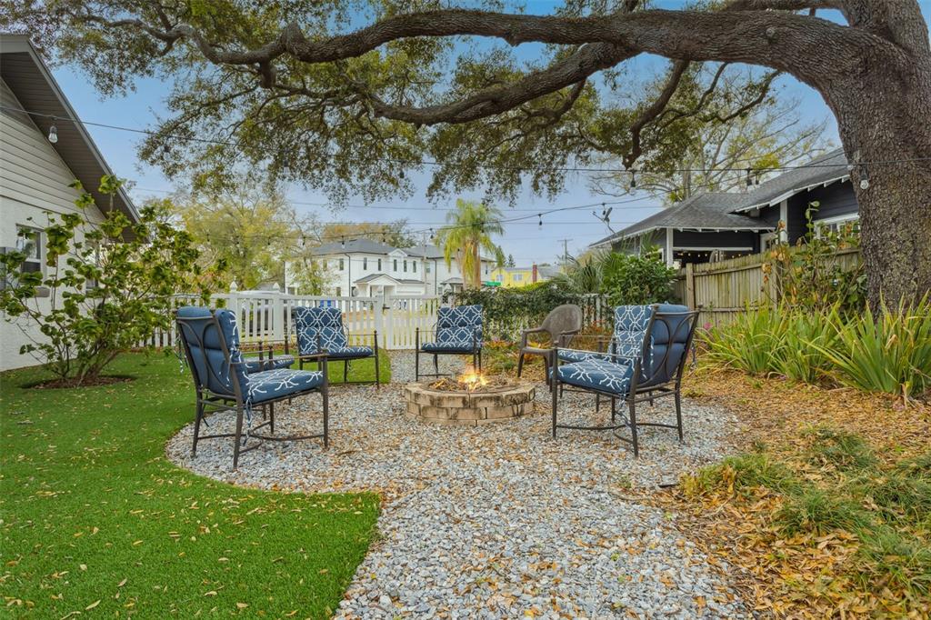 2603 North Ridgewood Avenue Tampa, FL 33602 - Photo 5 of 44 a view of a chairs and table in backyard