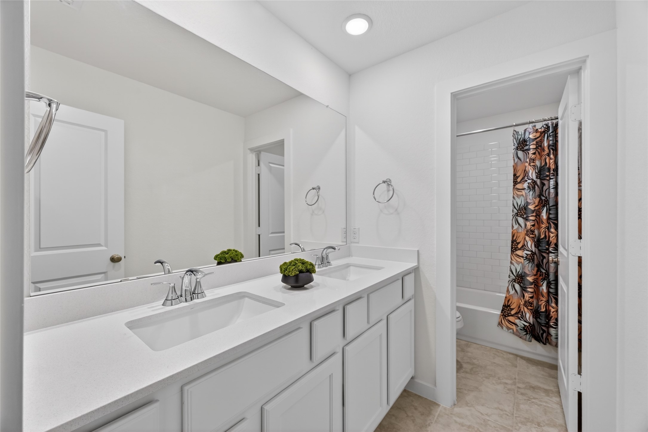 4439 Stone Ridge Lane Manvel, TX 77578 - Photo 38 of 48 a bathroom with a sink and a mirror