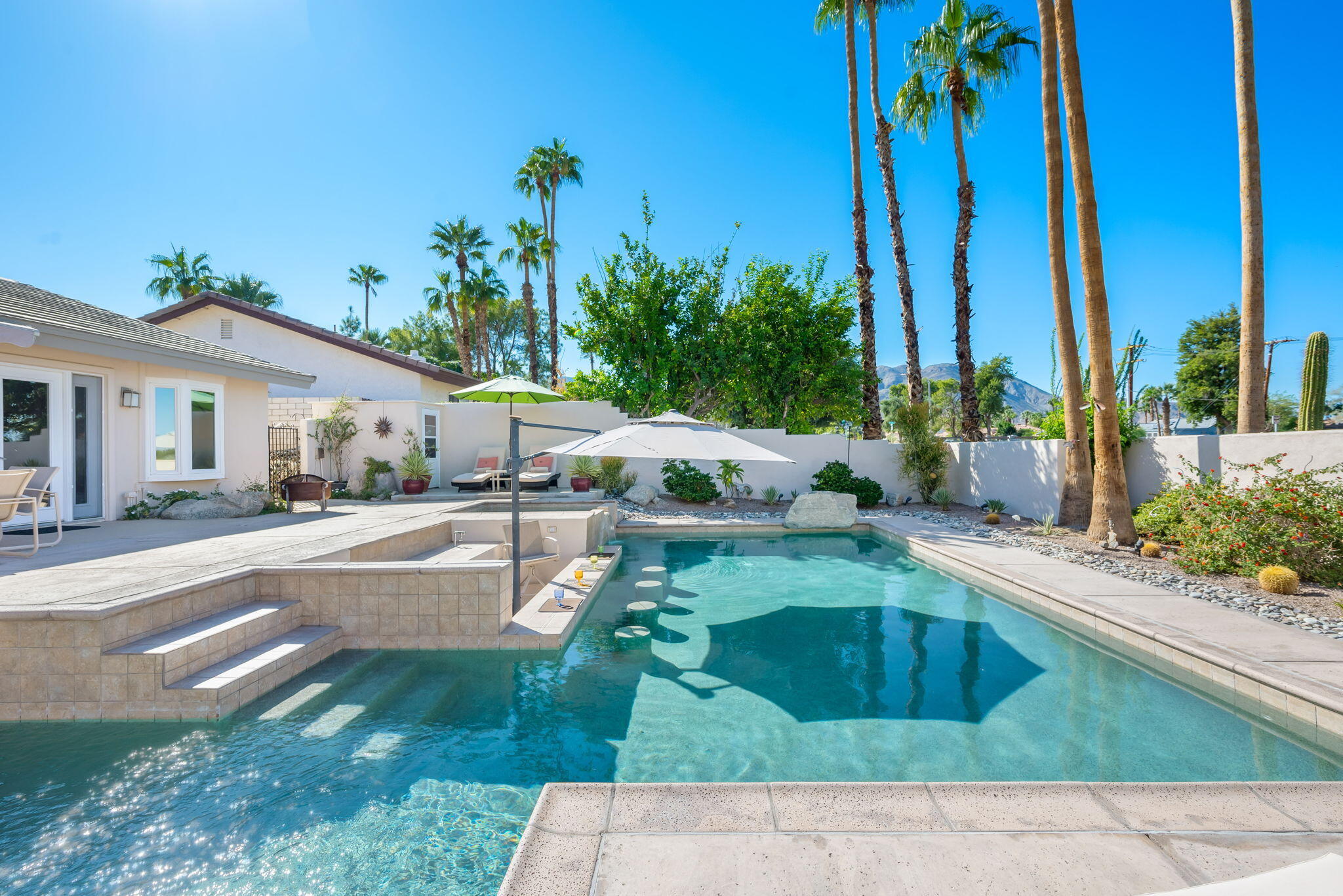 73535 Haystack Road Palm Desert, CA 92260 - Photo 1 of 47 a view of a swimming pool with a patio