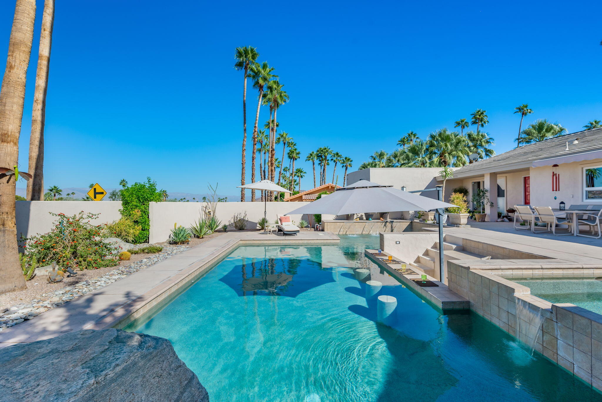 73535 Haystack Road Palm Desert, CA 92260 - Photo 12 of 47 a view of a house with swimming pool