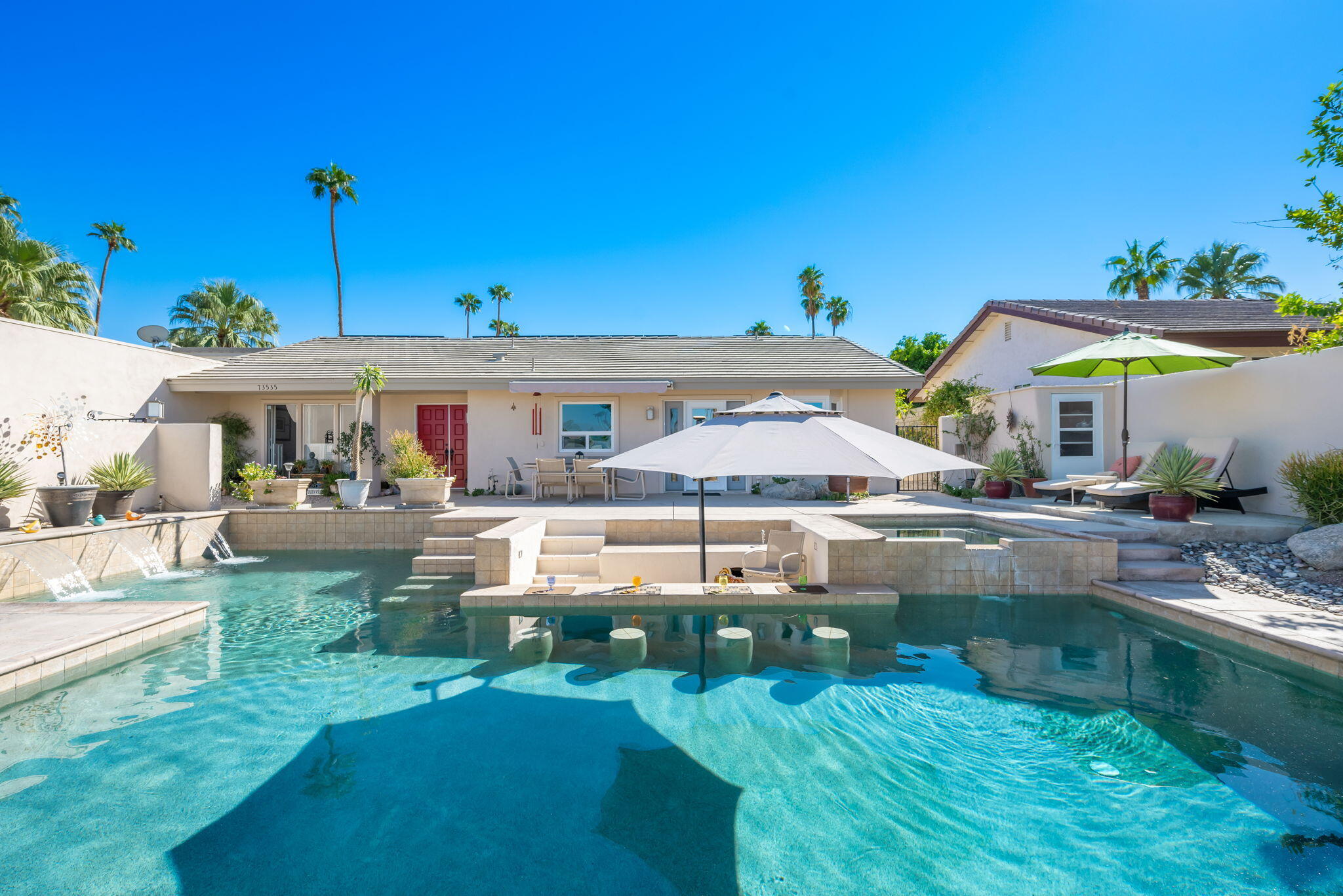 73535 Haystack Road Palm Desert, CA 92260 - Photo 14 of 47 a view of a house with a yard